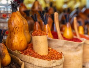 Bags,Full,Of,Various,Multicolored,Spices,And,Traditional,Wooden,Saltshaker