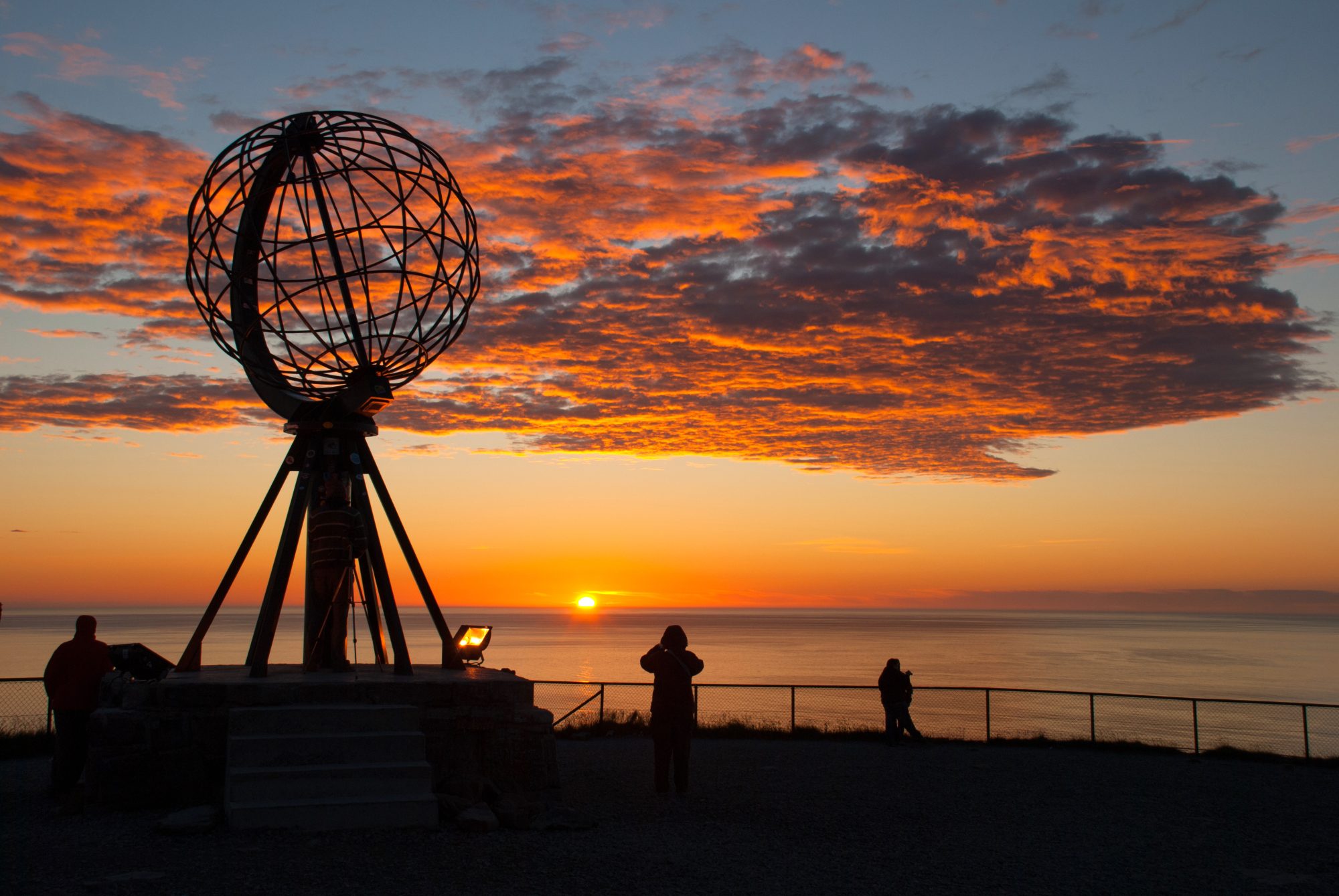 Nordkapp. Globe Monument at North Cape, Norway. Midnight at Nordkapp shutterstock_645471670